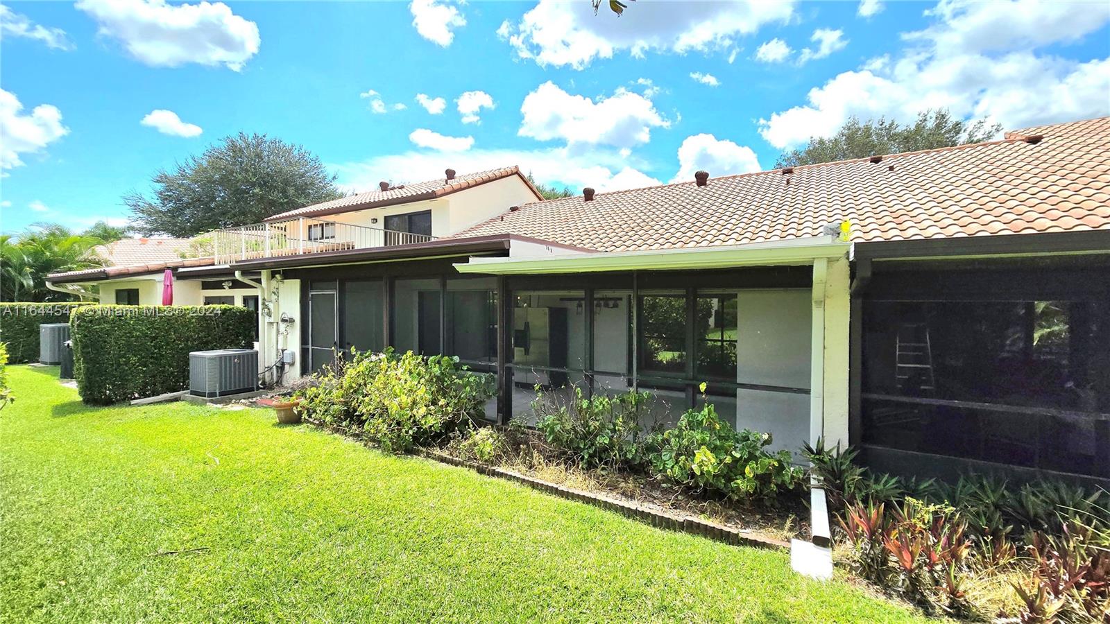 6727 Tiburon Circle Boca Raton, FL 33433 - Photo 6 of 36 a view of a house with potted plants and a large tree