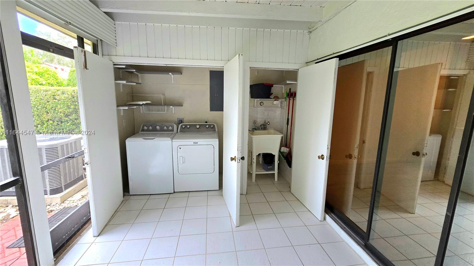 6727 Tiburon Circle Boca Raton, FL 33433 - Photo 8 of 36 a kitchen with a refrigerator and a sink