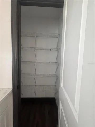 a view of an empty walk in closet
