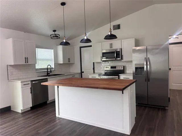 a view of a room with wooden floor and closet