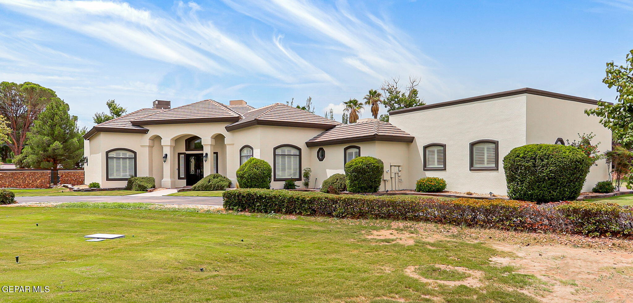 5301 Upper Valley Road El Paso, TX 79932 - Photo 1 of 1 a front view of a house with a yard