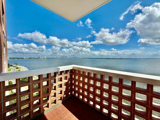 a view of a balcony with an ocean view