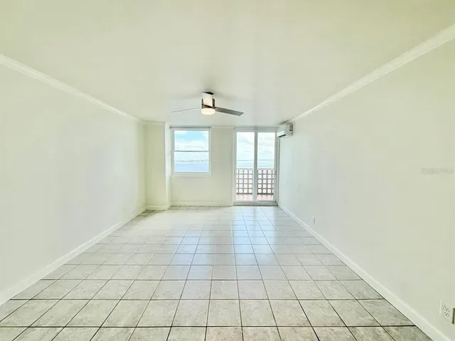 a view of an empty room with a window