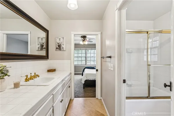 a bathroom with a sink and a shower