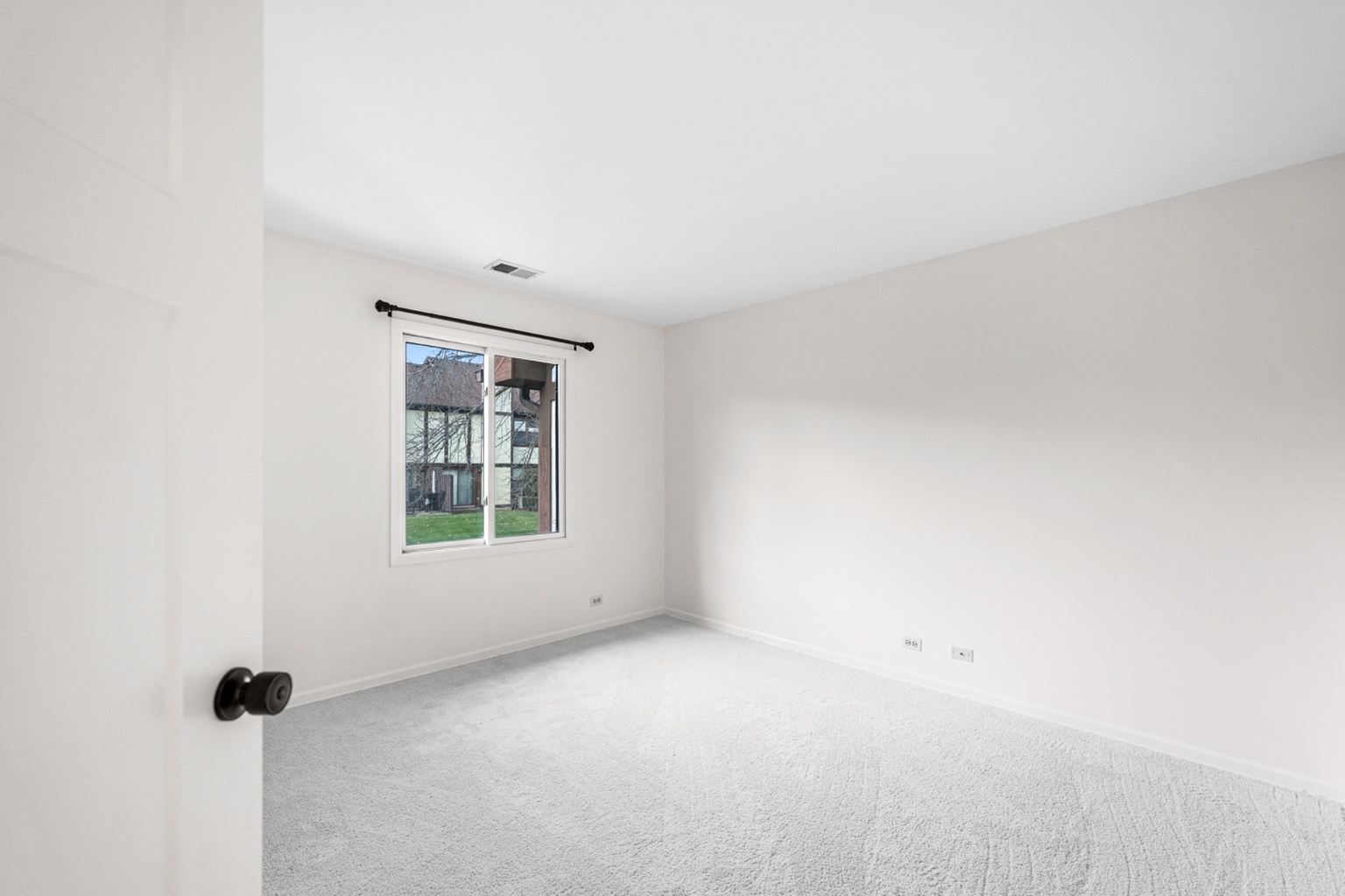 906 East Steger Road, Unit 5 Crete, IL 60417 - Photo 17 of 19 an empty room with a window