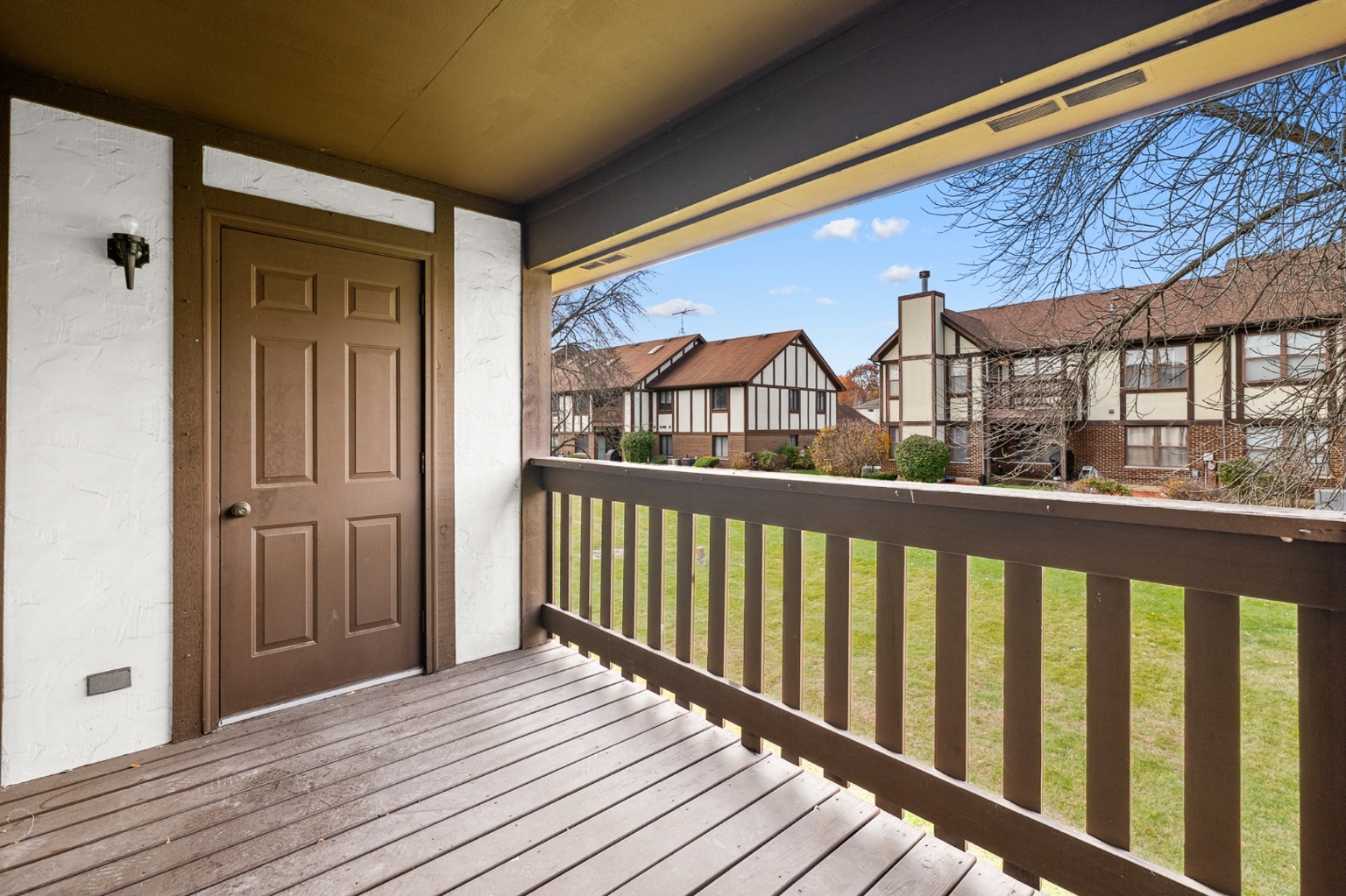 906 East Steger Road, Unit 5 Crete, IL 60417 - Photo 18 of 19 a view of a house with a balcony