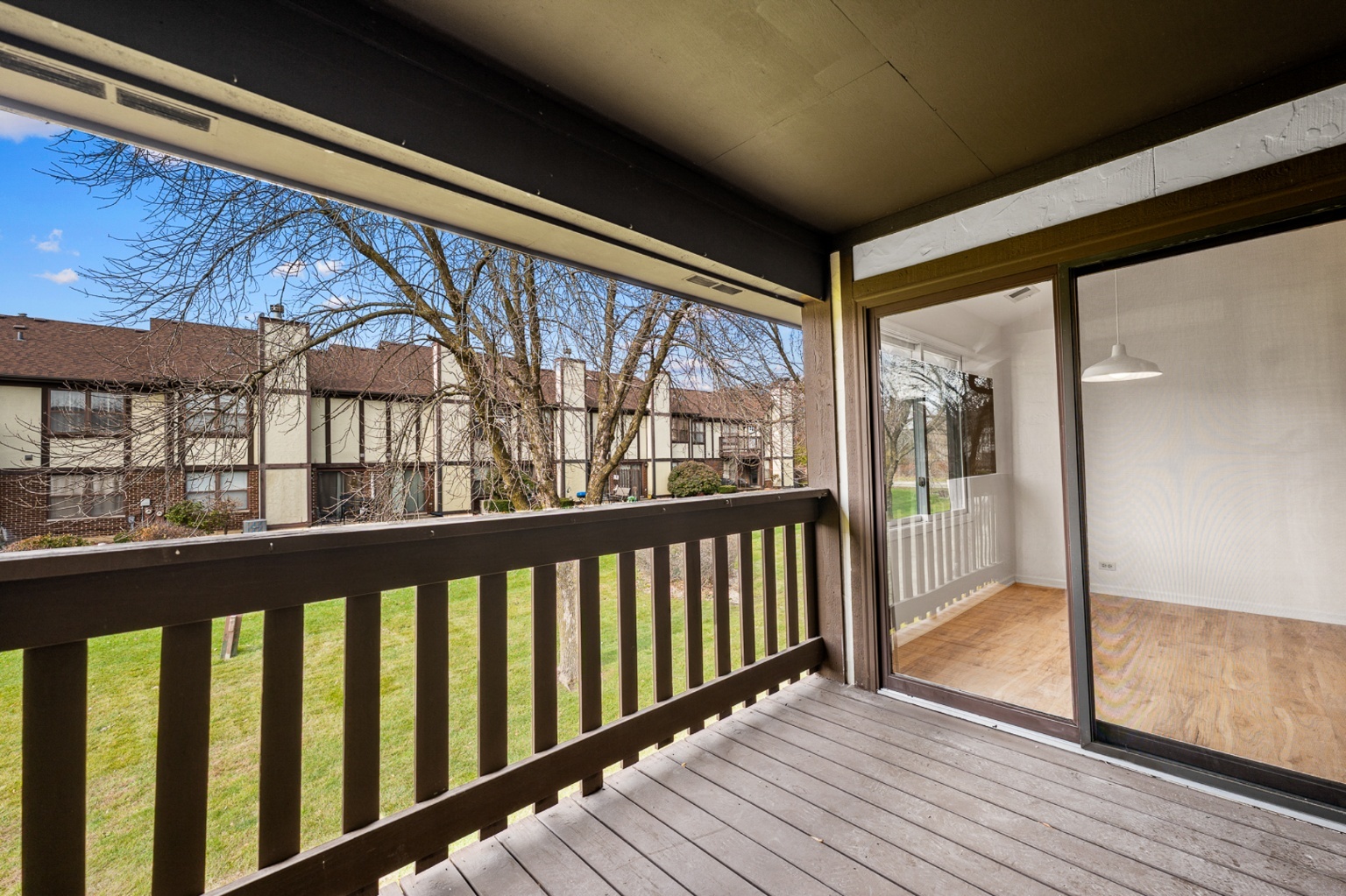 906 East Steger Road, Unit 5 Crete, IL 60417 - Photo 19 of 19 a view of a porch with wooden floor