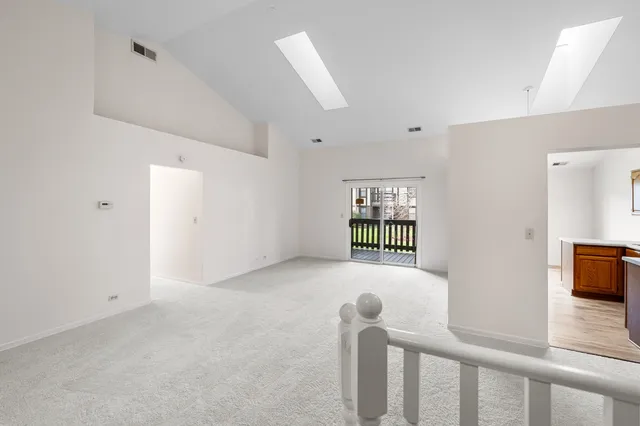 a view of empty room with windows