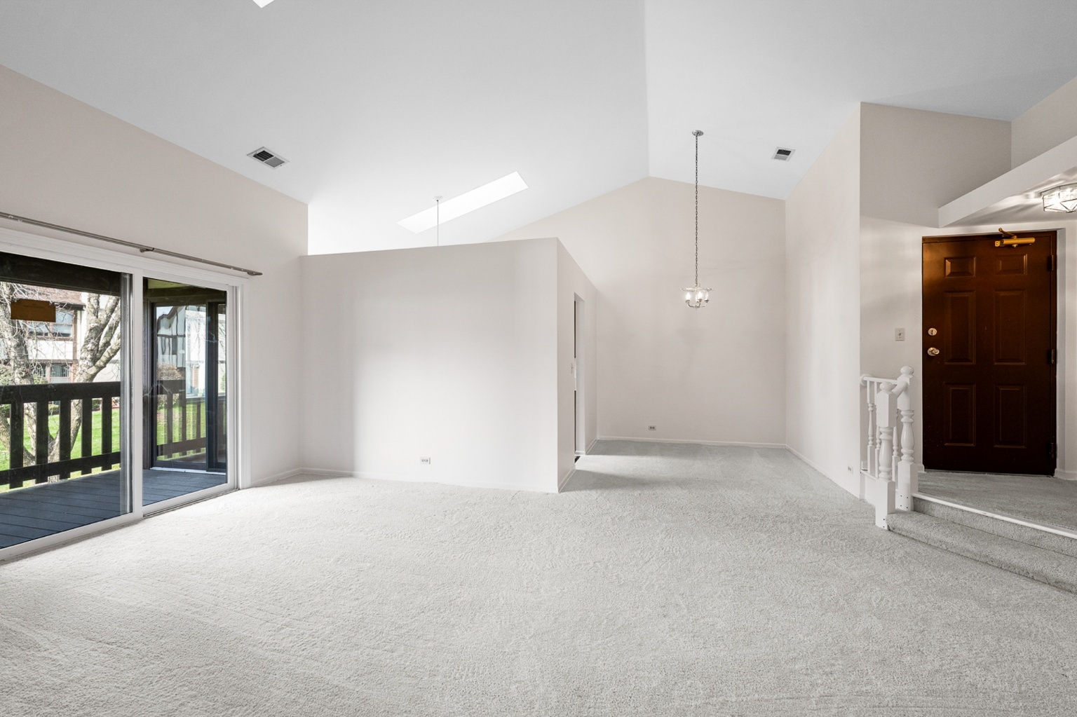 906 East Steger Road, Unit 5 Crete, IL 60417 - Photo 3 of 19 a view of an empty room with glass door and a window
