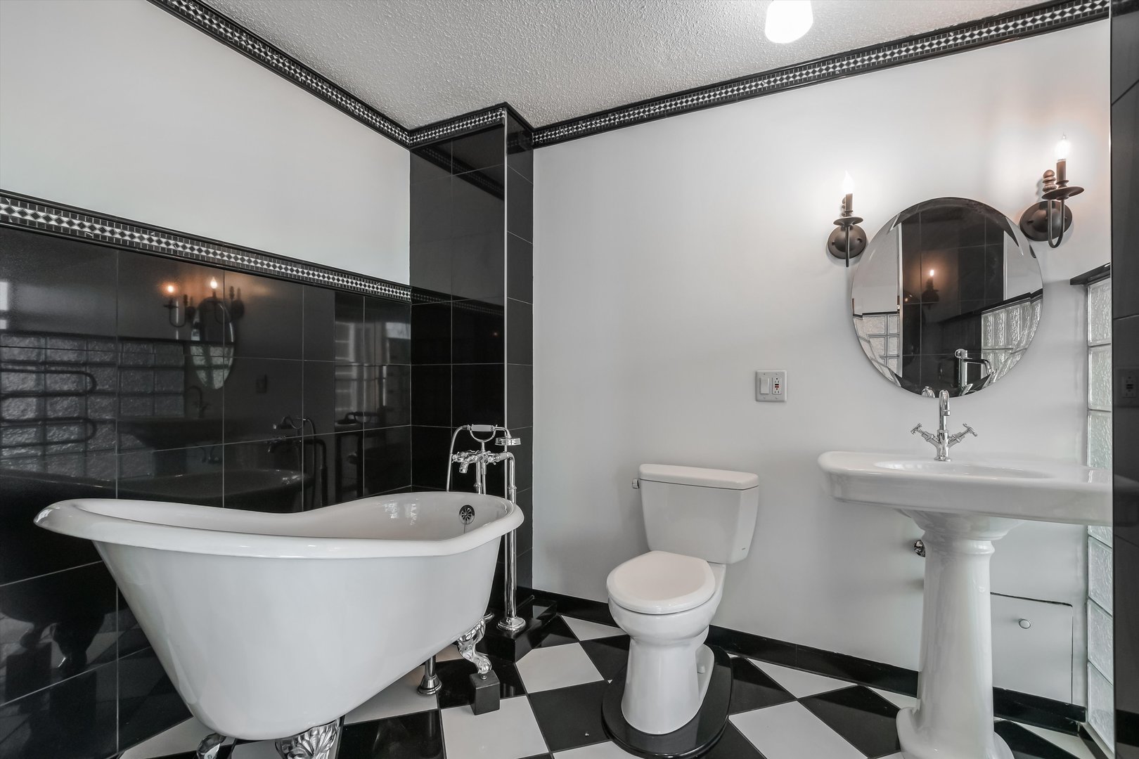 1450 North Astor Street, Unit 15AB Chicago, IL 60610 - Photo 13 of 23 a bathroom with a sink a toilet a mirror and shower