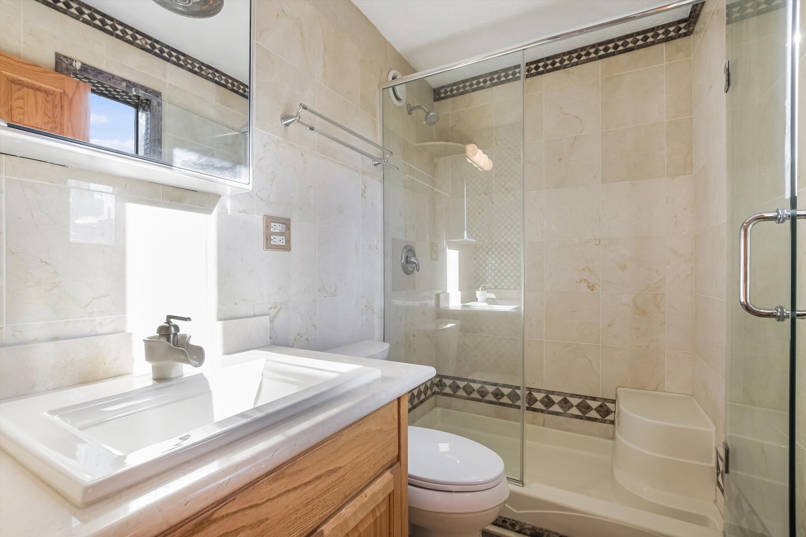1450 North Astor Street, Unit 15AB Chicago, IL 60610 - Photo 16 of 23 a bathroom with a granite countertop sink toilet and shower