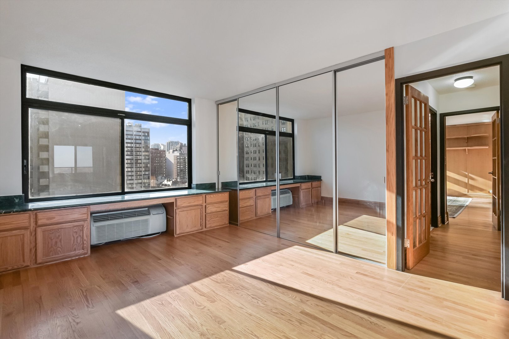 1450 North Astor Street, Unit 15AB Chicago, IL 60610 - Photo 17 of 23 a living room with stainless steel appliances granite countertop wooden floor and glass door