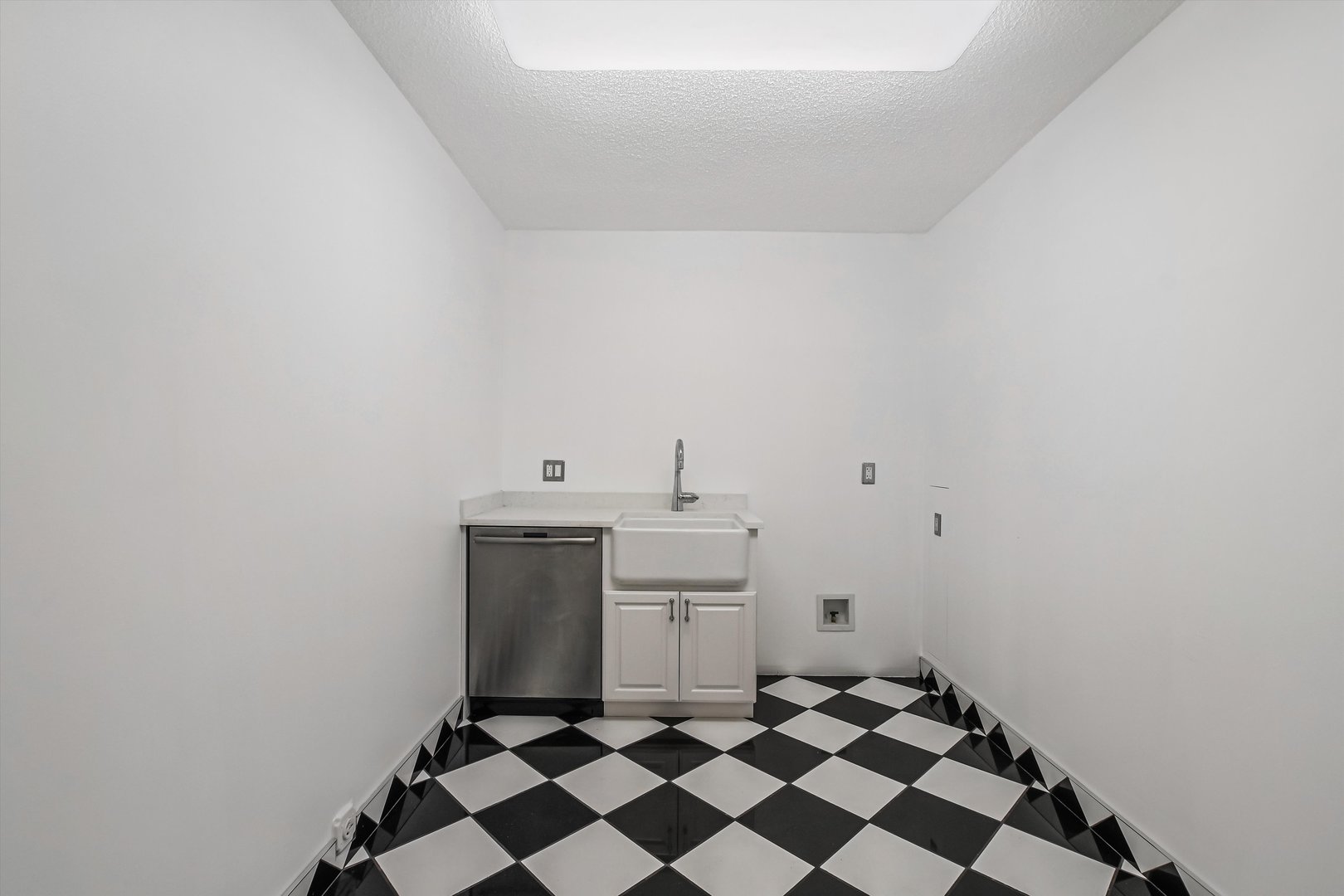 1450 North Astor Street, Unit 15AB Chicago, IL 60610 - Photo 19 of 23 a room with a stove top oven and a sink