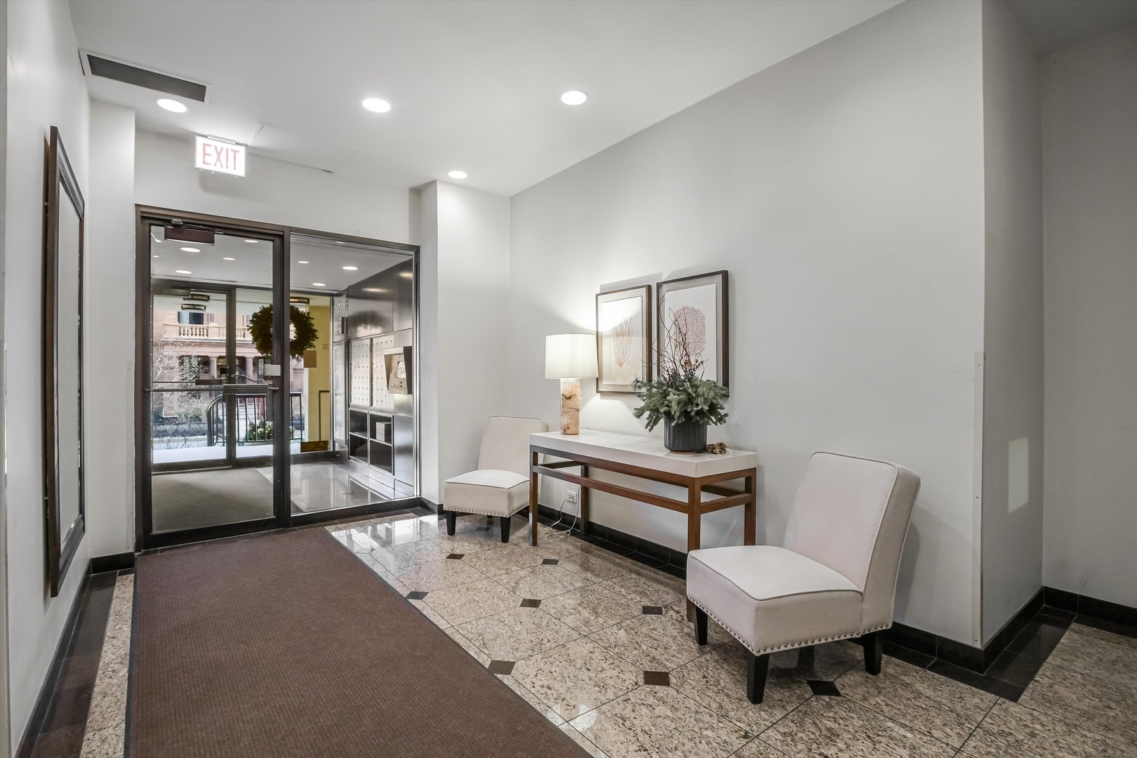 1450 North Astor Street, Unit 15AB Chicago, IL 60610 - Photo 2 of 23 a living room with furniture and a potted plant