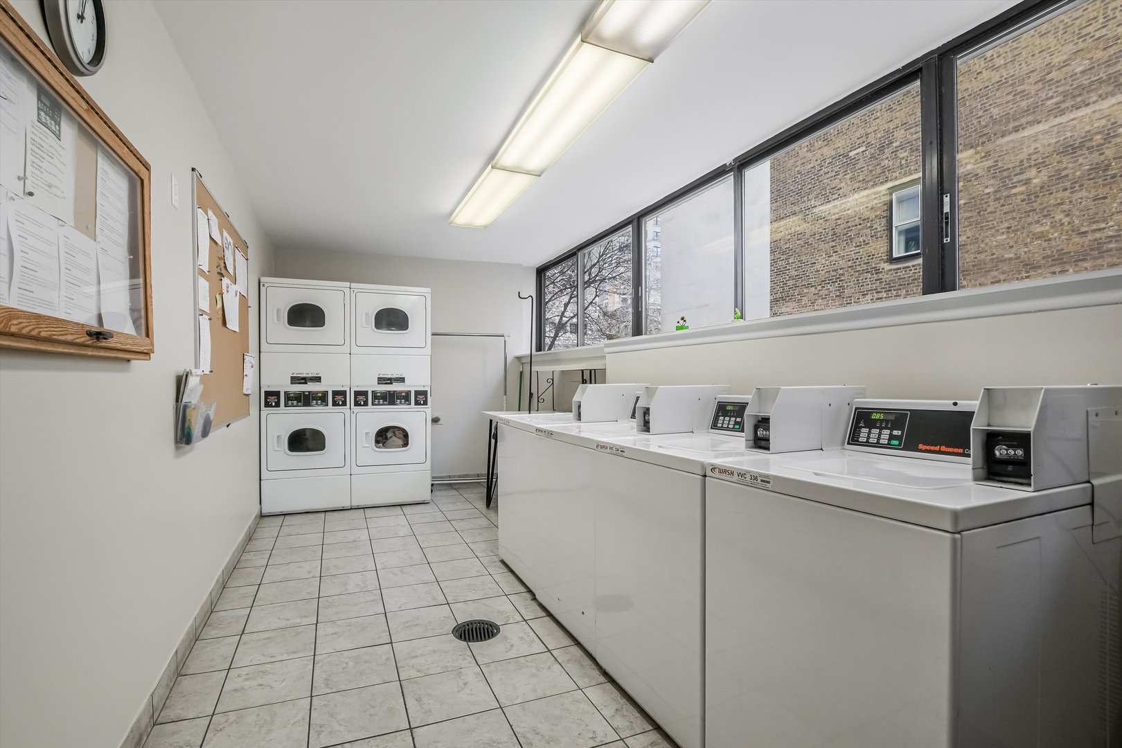 1450 North Astor Street, Unit 15AB Chicago, IL 60610 - Photo 21 of 23 a kitchen with stainless steel appliances a sink and a refrigerator