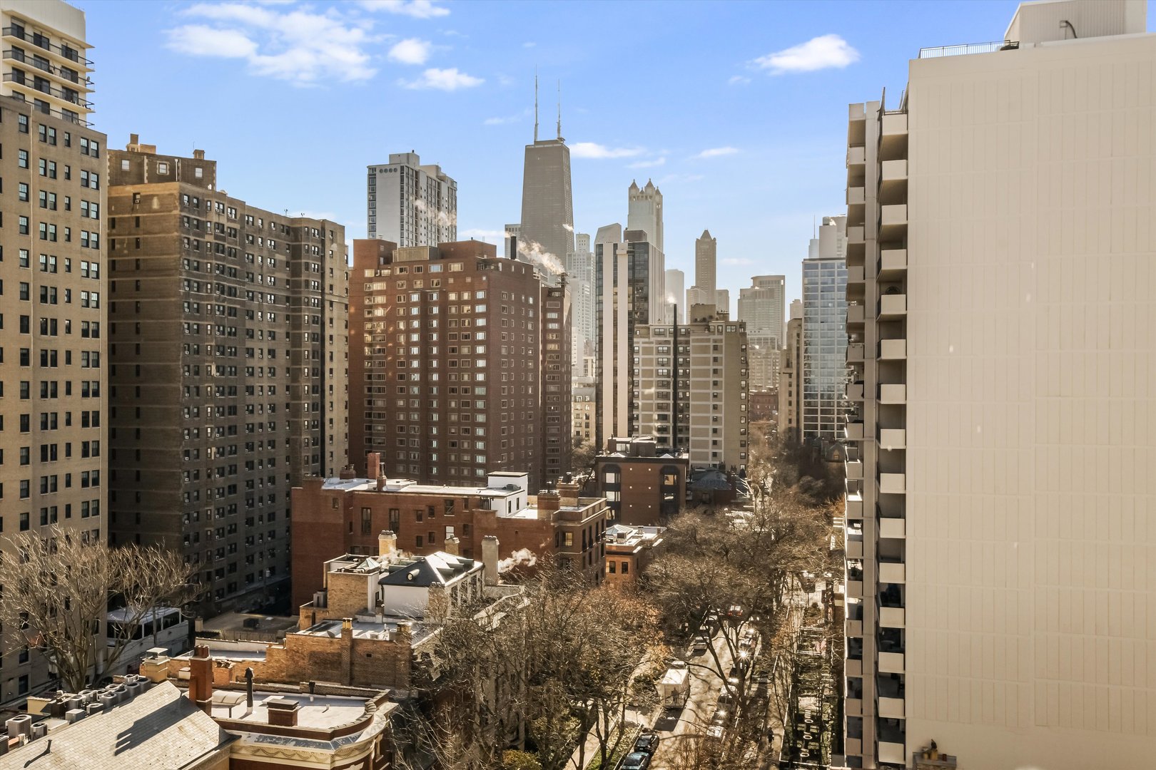 1450 North Astor Street, Unit 15AB Chicago, IL 60610 - Photo 22 of 23 a view of a city with tall buildings