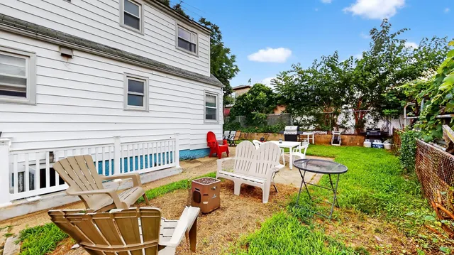 a view of a patio with a chairs and table in a patio