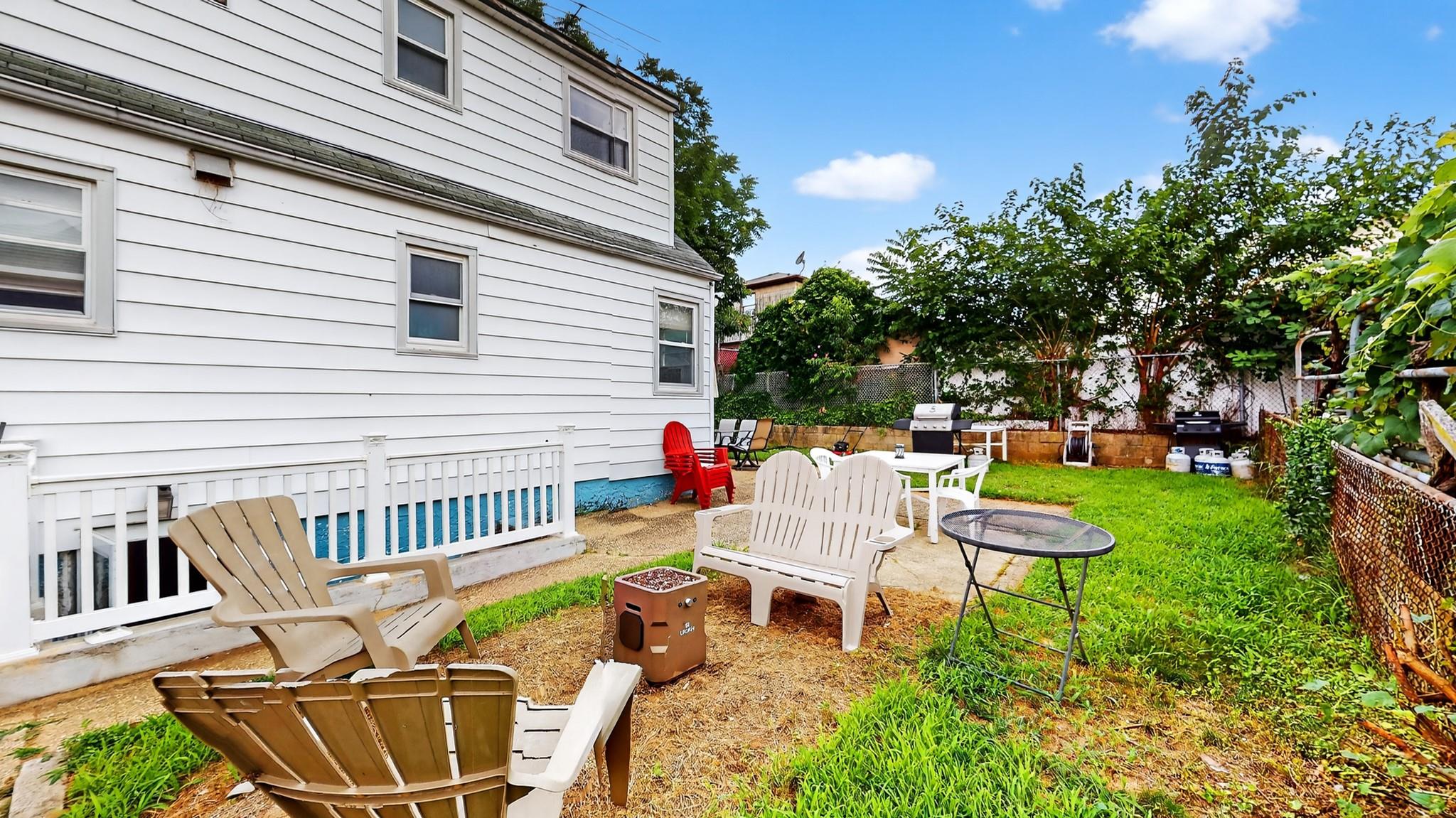1332 A Street Elmont, NY 11003 - Photo 17 of 19 a view of a patio with a chairs and table in a patio