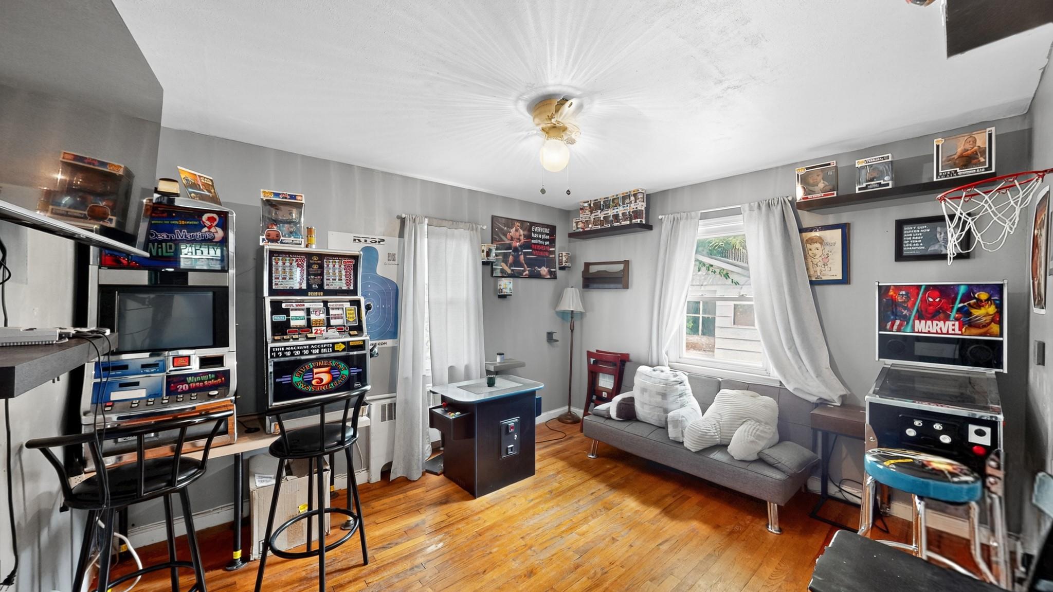 1332 A Street Elmont, NY 11003 - Photo 7 of 19 a living room with lots of furniture and a flat screen tv