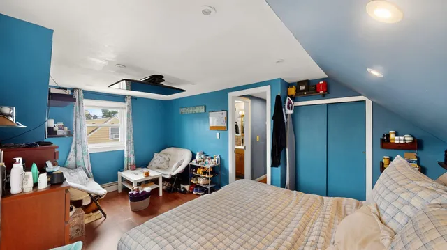 a bedroom with furniture and a chandelier