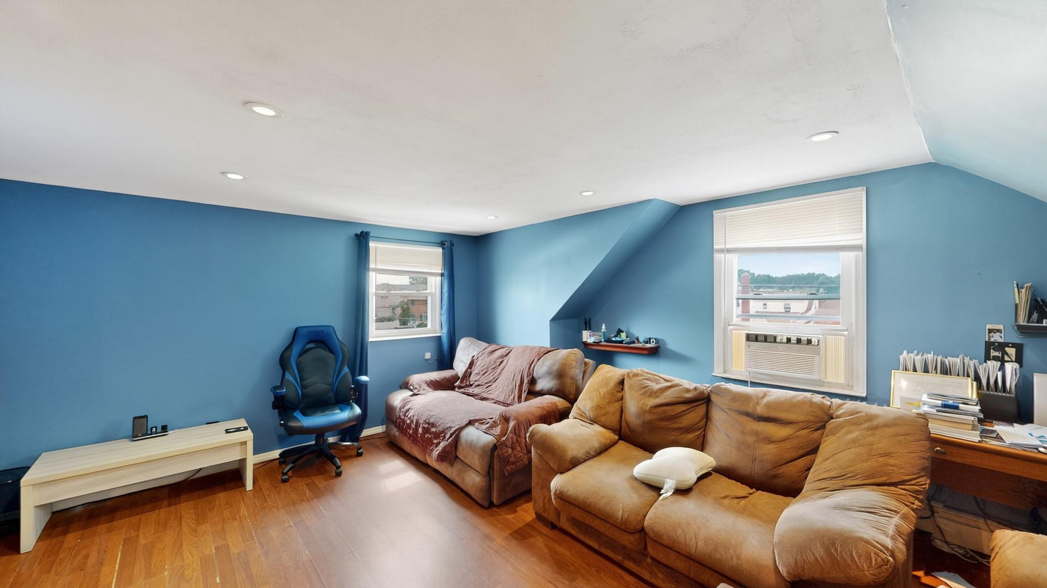 1332 A Street Elmont, NY 11003 - Photo 10 of 19 a living room with furniture window and a wooden floor