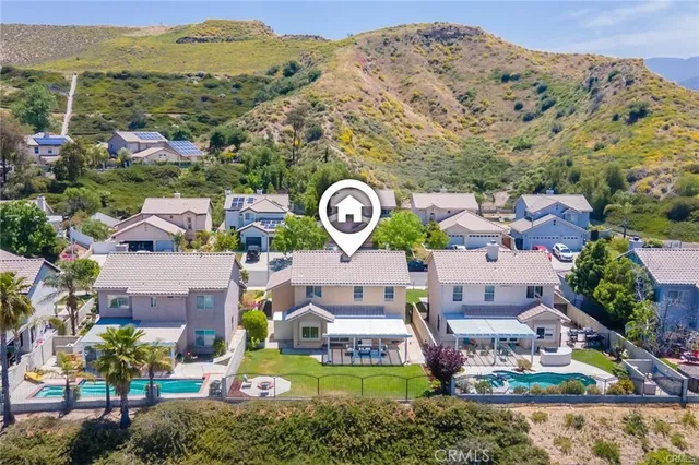 a view of a city with lush green forest