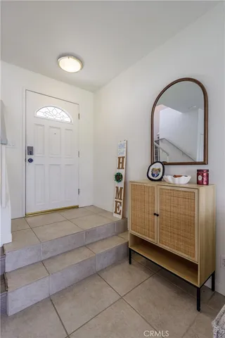 a view of front door with washer and dryer