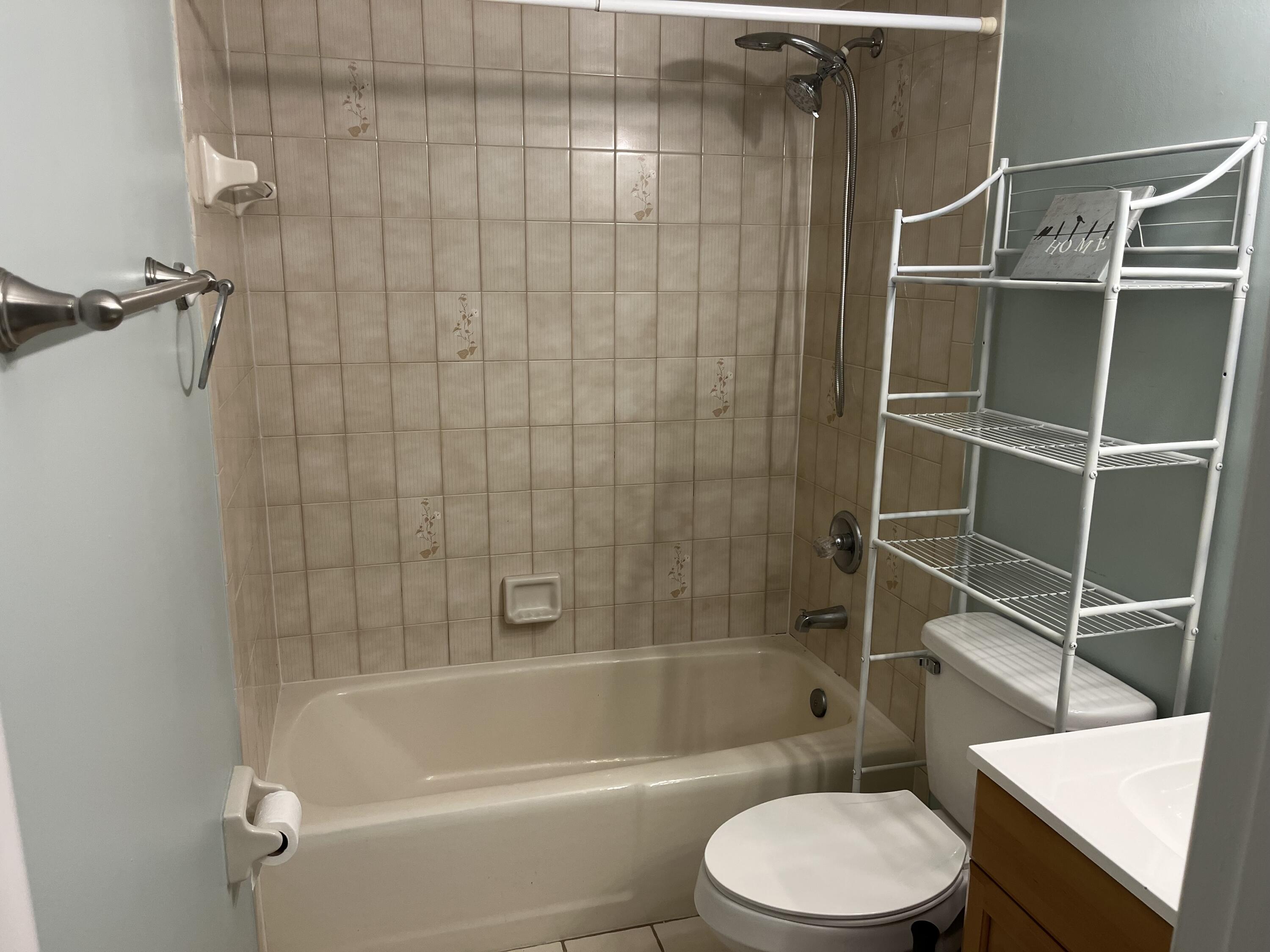 491 Southwest Curtis Street Port St. Lucie, FL 34983 - Photo 6 of 8 a bathroom with a toilet and shower