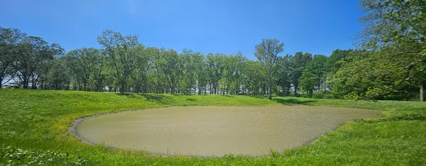 a view of a golf course with a house