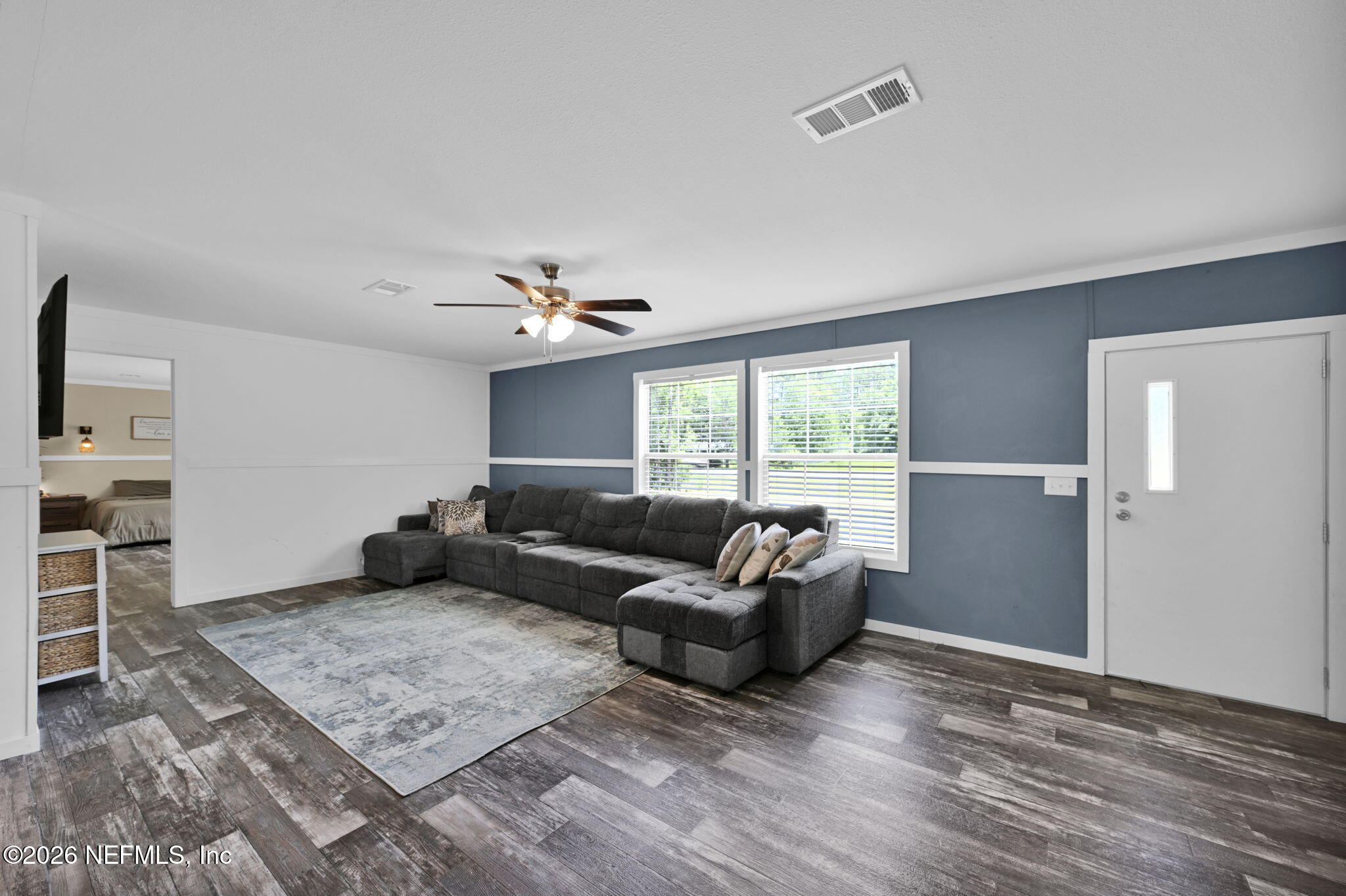 540783 Lem Turner Road Callahan, FL 32011 - Photo 9 of 36 a living room with furniture window and wooden floor