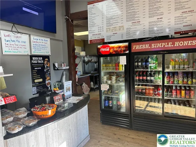 a kitchen with stainless steel appliances granite countertop a stove and cabinets