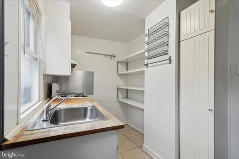a utility room with cabinets