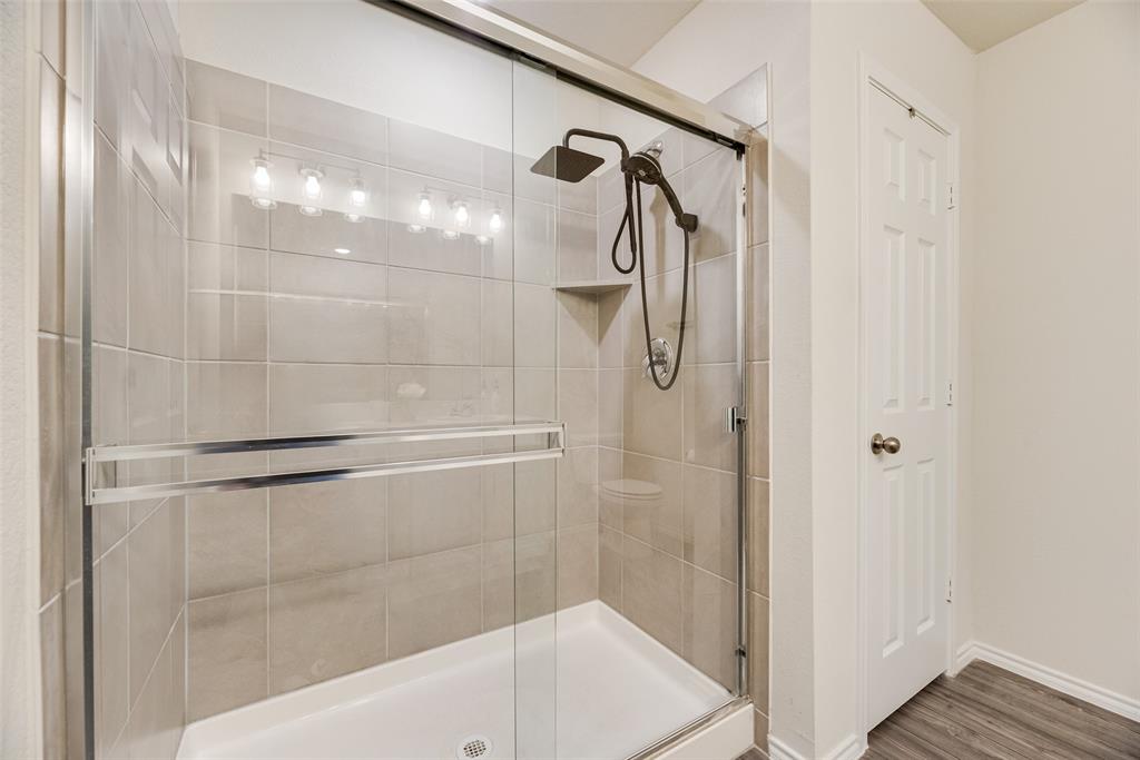 7005 Adderly Road Pilot Point, TX 76258 - Photo 21 of 38 Primary bathroom with walk-in shower and linen closet