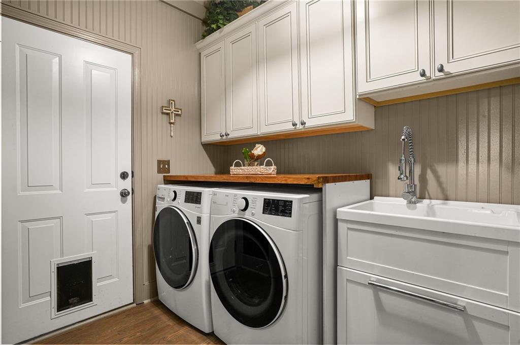 509 Crested Hawk Ridge Canton, GA 30114 - Photo 22 of 89 a utility room with dryer and washer