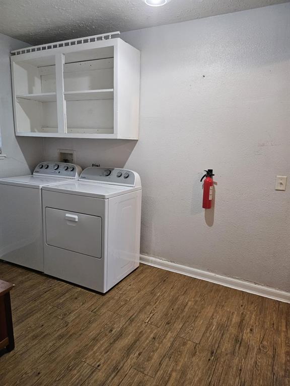 108 2nd Street Whitney, TX 76692 - Photo 12 of 15 a room with a wooden floor and cabinets