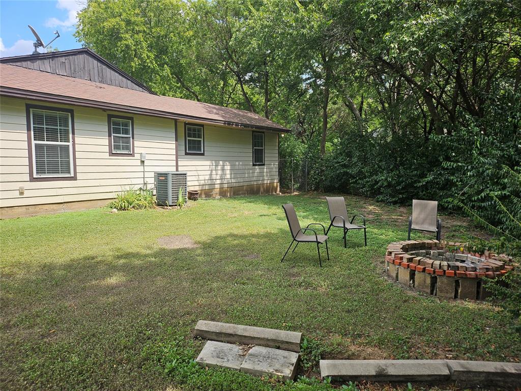 108 2nd Street Whitney, TX 76692 - Photo 13 of 15 a backyard of a house with table and chairs