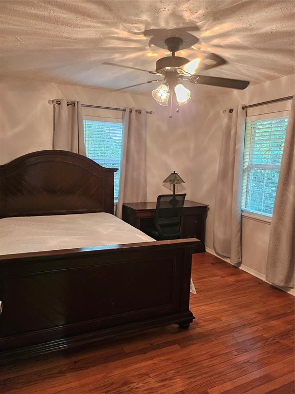 108 2nd Street Whitney, TX 76692 - Photo 8 of 15 a bed sitting in a bedroom next to a window