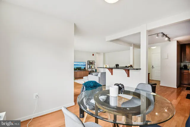 a kitchen with a table and chairs