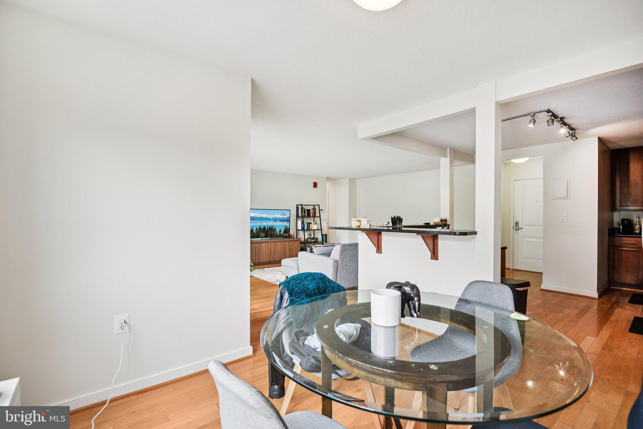 7333 New Hampshire Avenue, Unit 311S Takoma Park, MD 20912 - Photo 13 of 27 a kitchen with a table and chairs