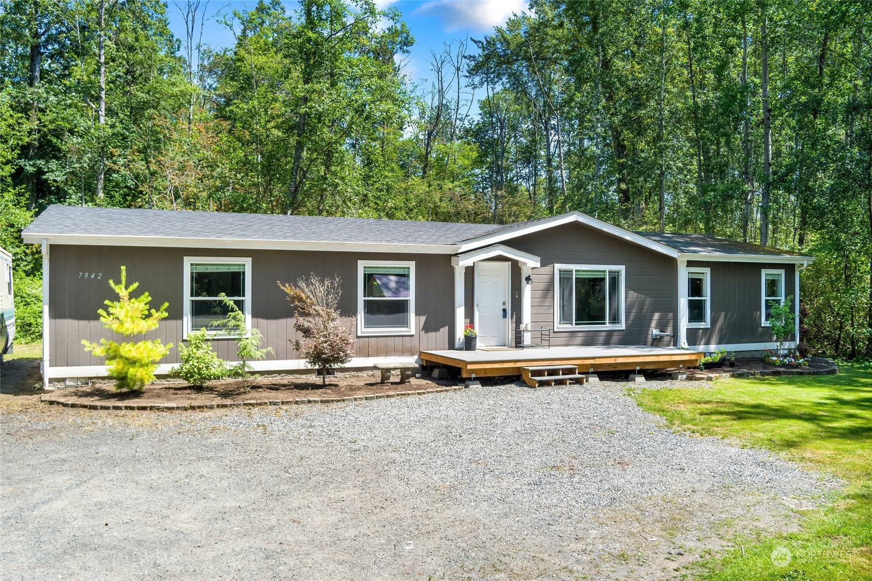 a front view of house with swimming pool and porch with furniture