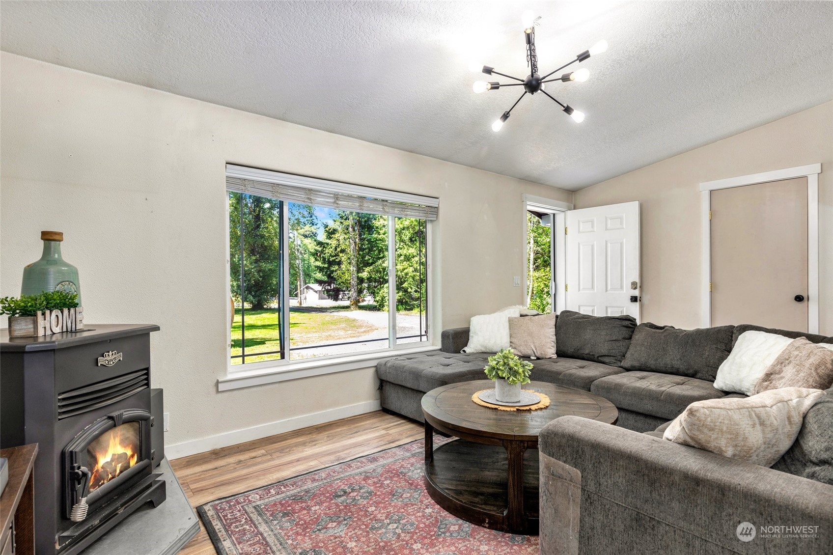 7942 Crockett Road Blaine, WA 98230 - Photo 11 of 33 a living room with furniture and a fireplace