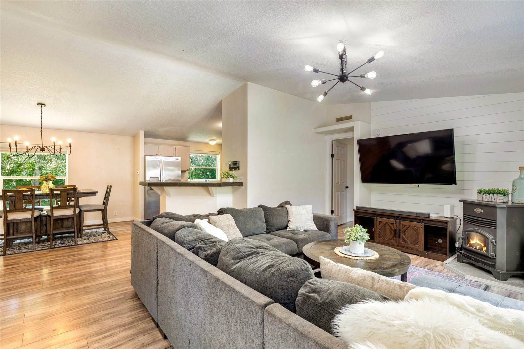7942 Crockett Road Blaine, WA 98230 - Photo 13 of 33 a living room with furniture and a flat screen tv