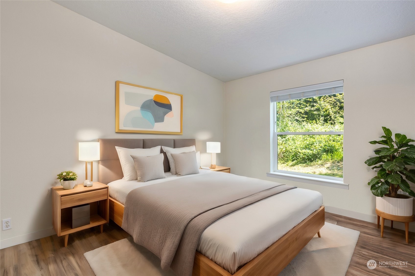 7942 Crockett Road Blaine, WA 98230 - Photo 27 of 33 a bedroom with a bed and a chair