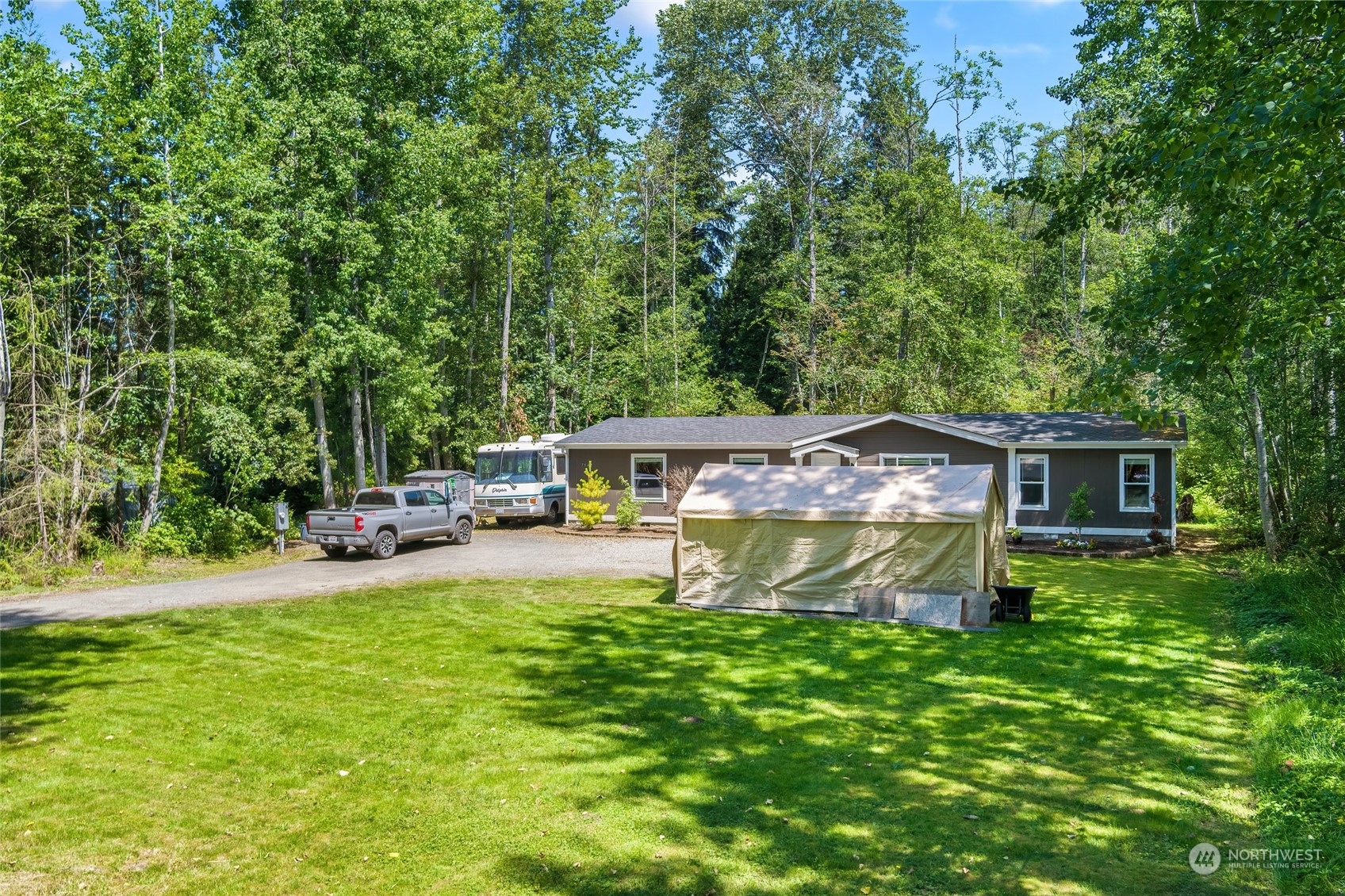 7942 Crockett Road Blaine, WA 98230 - Photo 3 of 33 a house view with a sitting space and garden