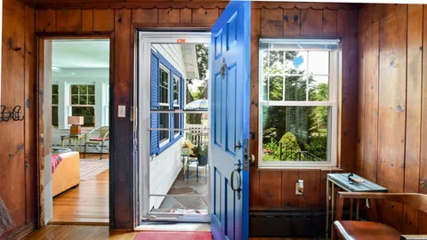 a view of a livingroom with furniture and front door