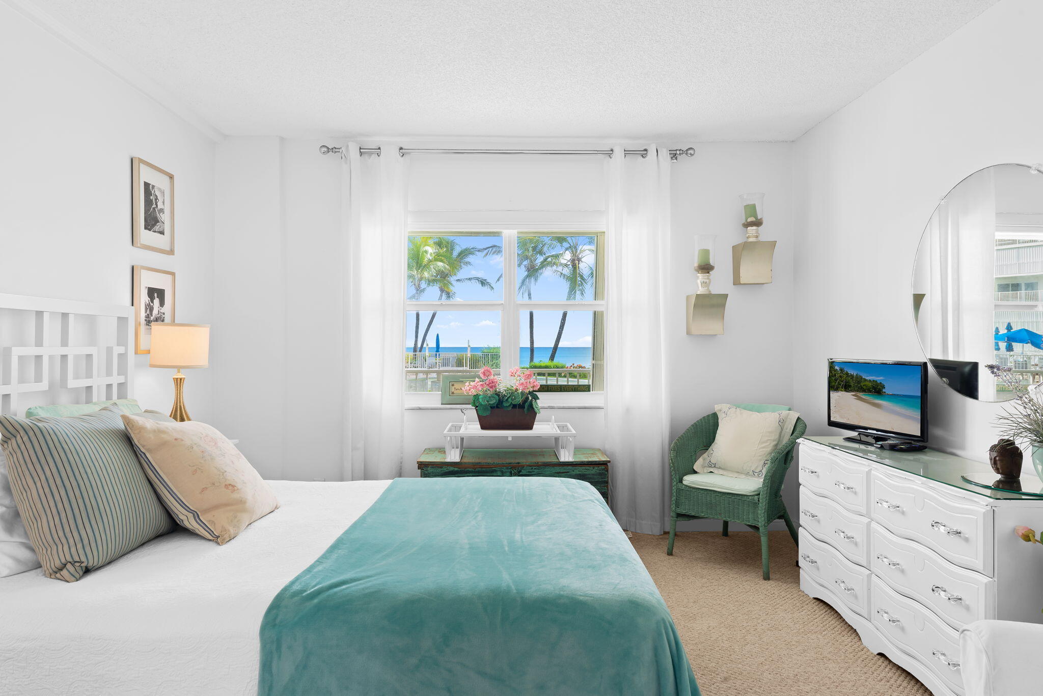 3101 South Ocean Boulevard, Unit 102 Highland Beach, FL 33487 - Photo 13 of 19 a bedroom with a bed a couch and dresser