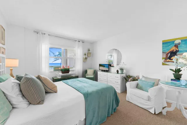 a bedroom with furniture and a window