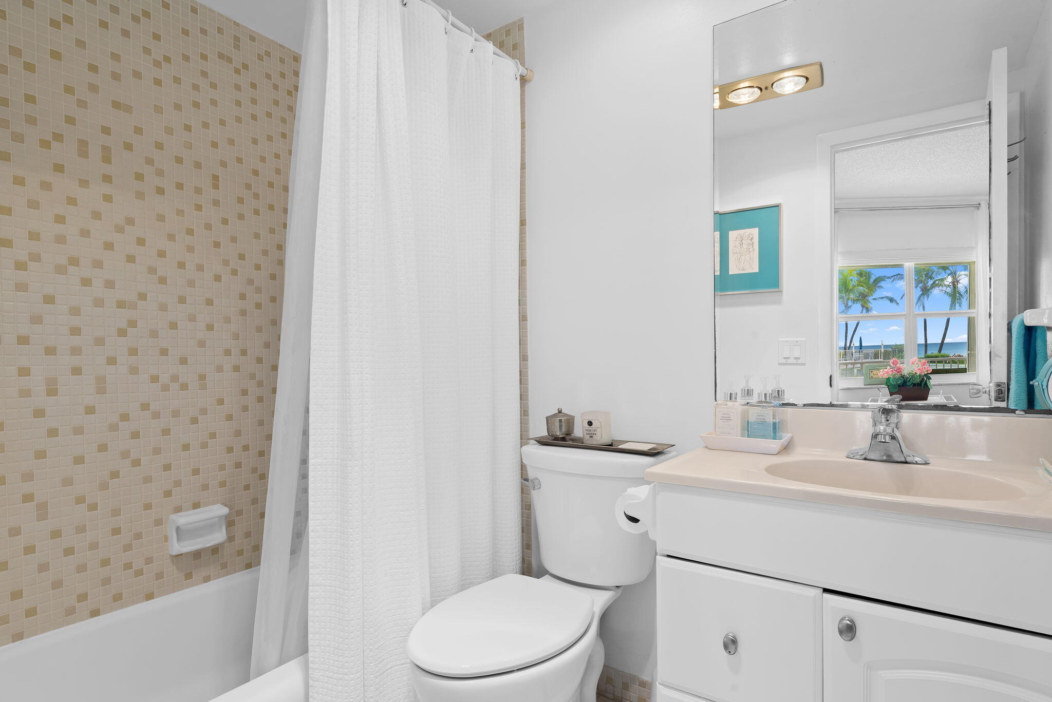 3101 South Ocean Boulevard, Unit 102 Highland Beach, FL 33487 - Photo 16 of 19 a bathroom with a sink a toilet and shower