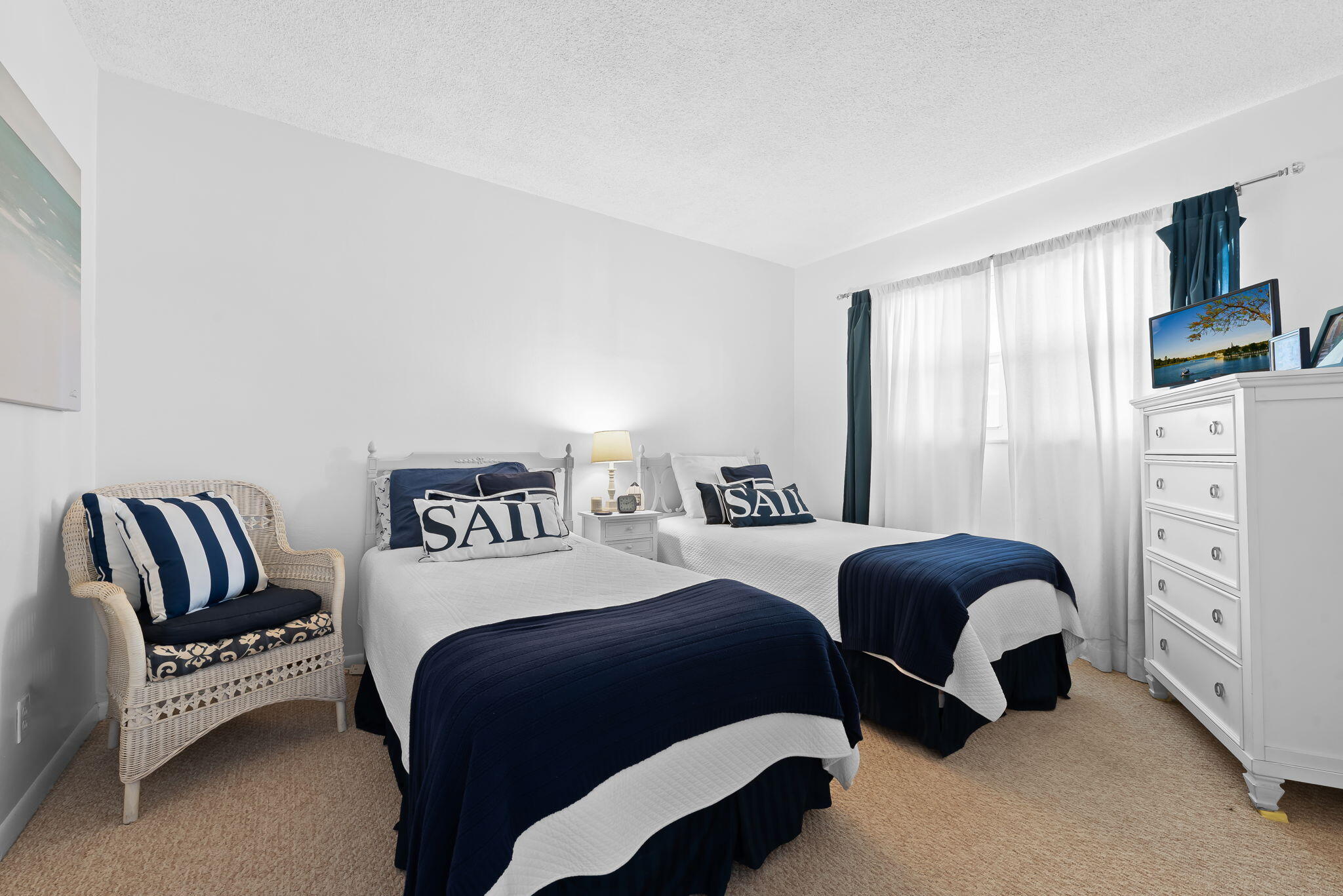 3101 South Ocean Boulevard, Unit 102 Highland Beach, FL 33487 - Photo 17 of 19 a bedroom with a bed and a couch