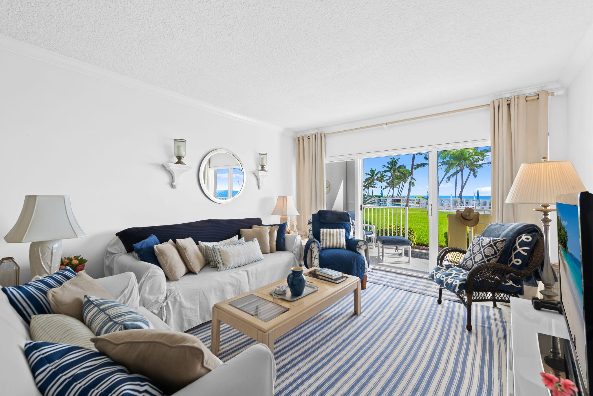 3101 South Ocean Boulevard, Unit 102 Highland Beach, FL 33487 - Photo 4 of 19 a living room with furniture and a large window